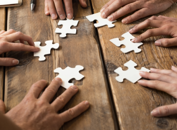 team putting a puzzle together