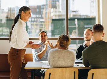 person presenting in a conference room