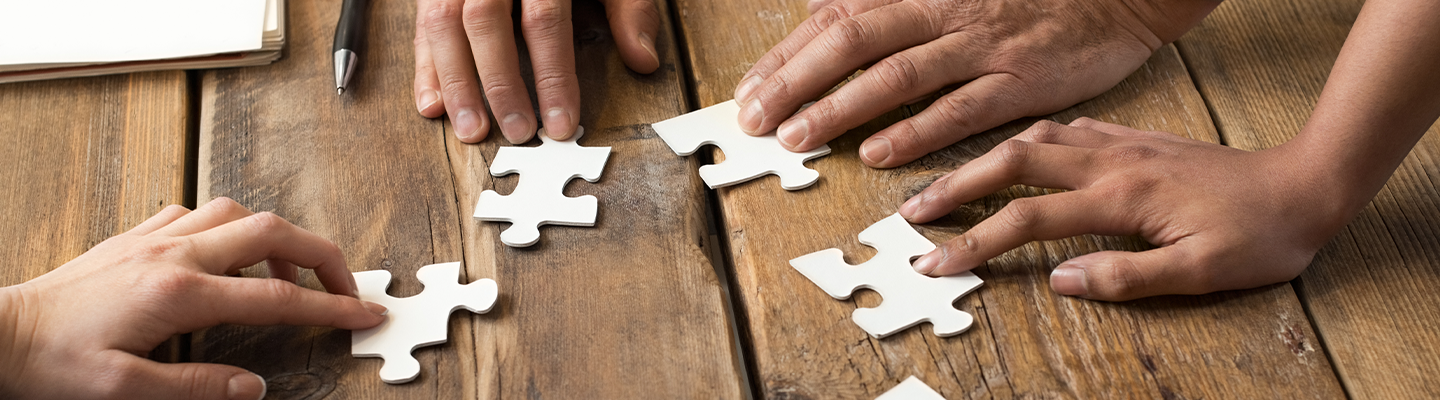 team assembling a puzzle